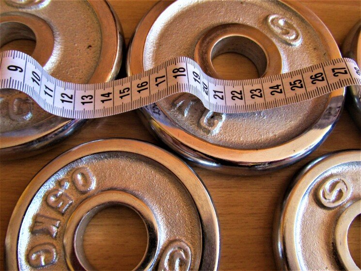 Halterschrijven met meetlint.