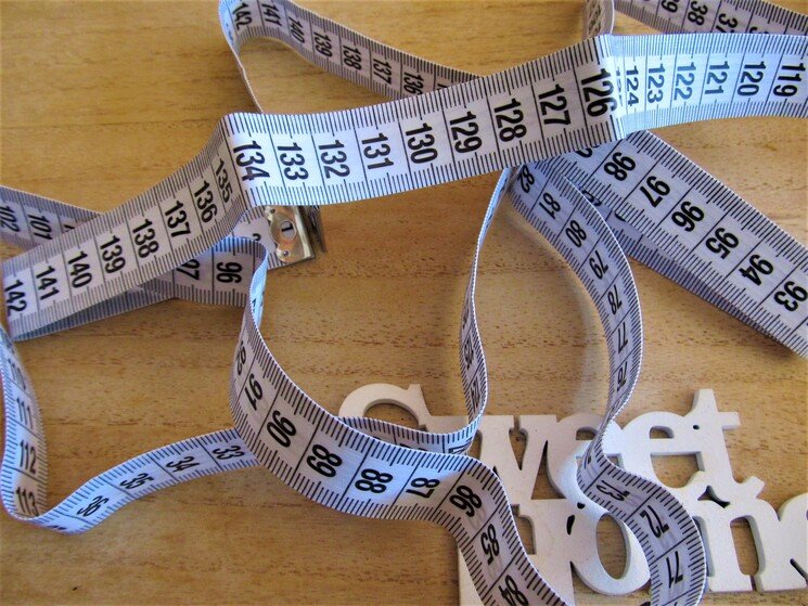 Vetpercentage bepalen met meetlint.